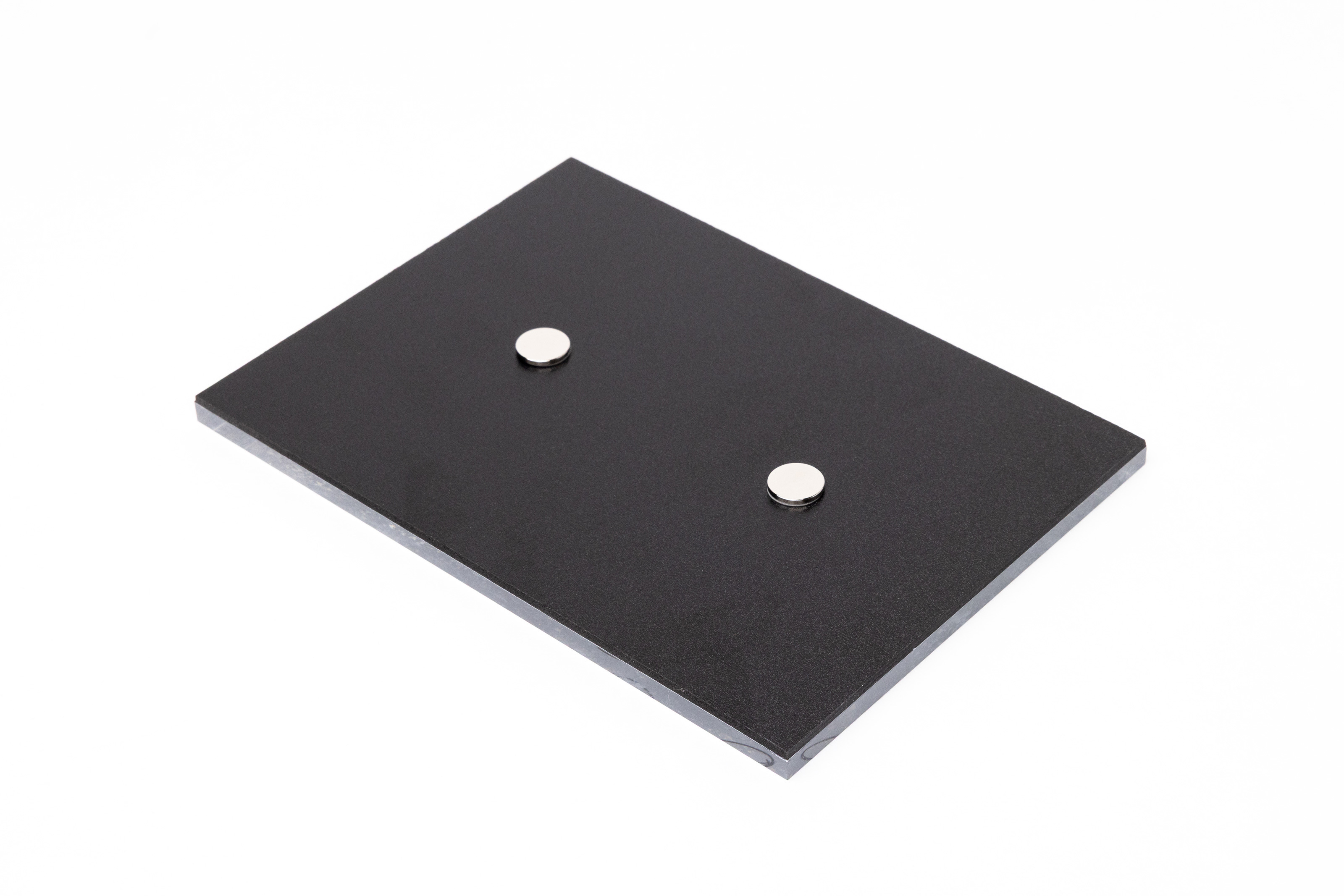 5×7 Acrylic Print lying face down on wa hite background to show two round magnets on the back for display hardware