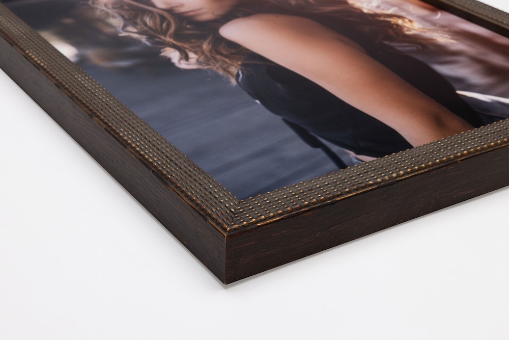 Corner detail of Antique Brown Patina Dot Frame moulding