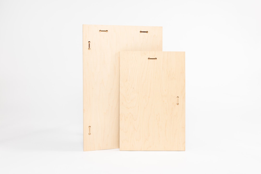 Back of two large vertical Wood Prints featuring the pre-cut keyhole display hardware. Keyholes are included for both hanging directions, with two on each side for the largest size