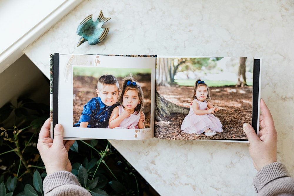 WHCC Family photo Hardcover Book, shown opened.