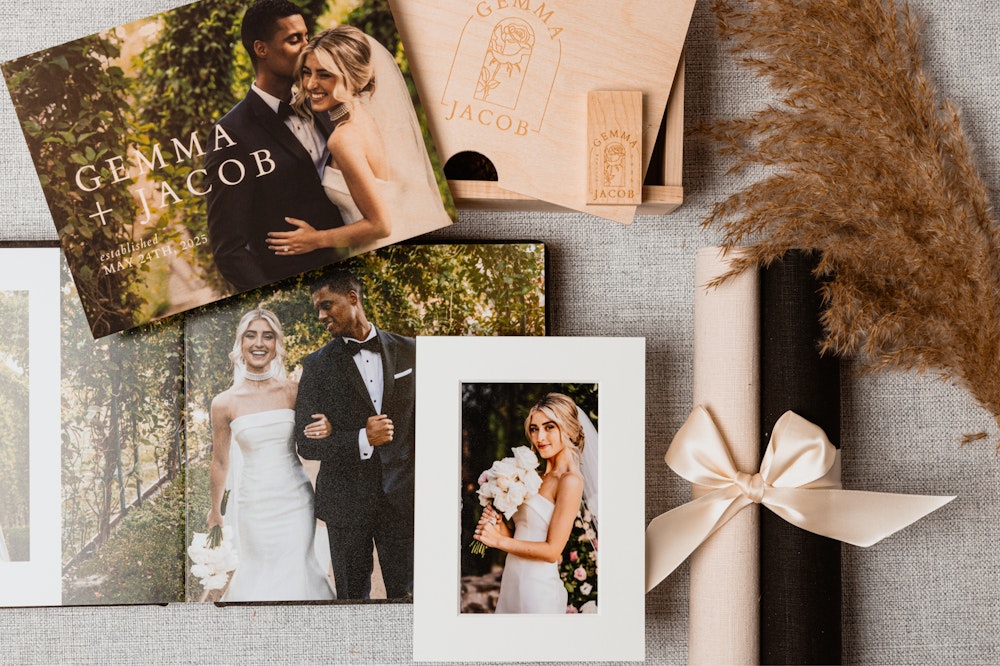 A variety of photo print products arranged on a table featuring images from a couple's wedding