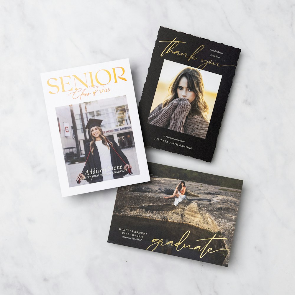 3 foil grad cards on a marble background