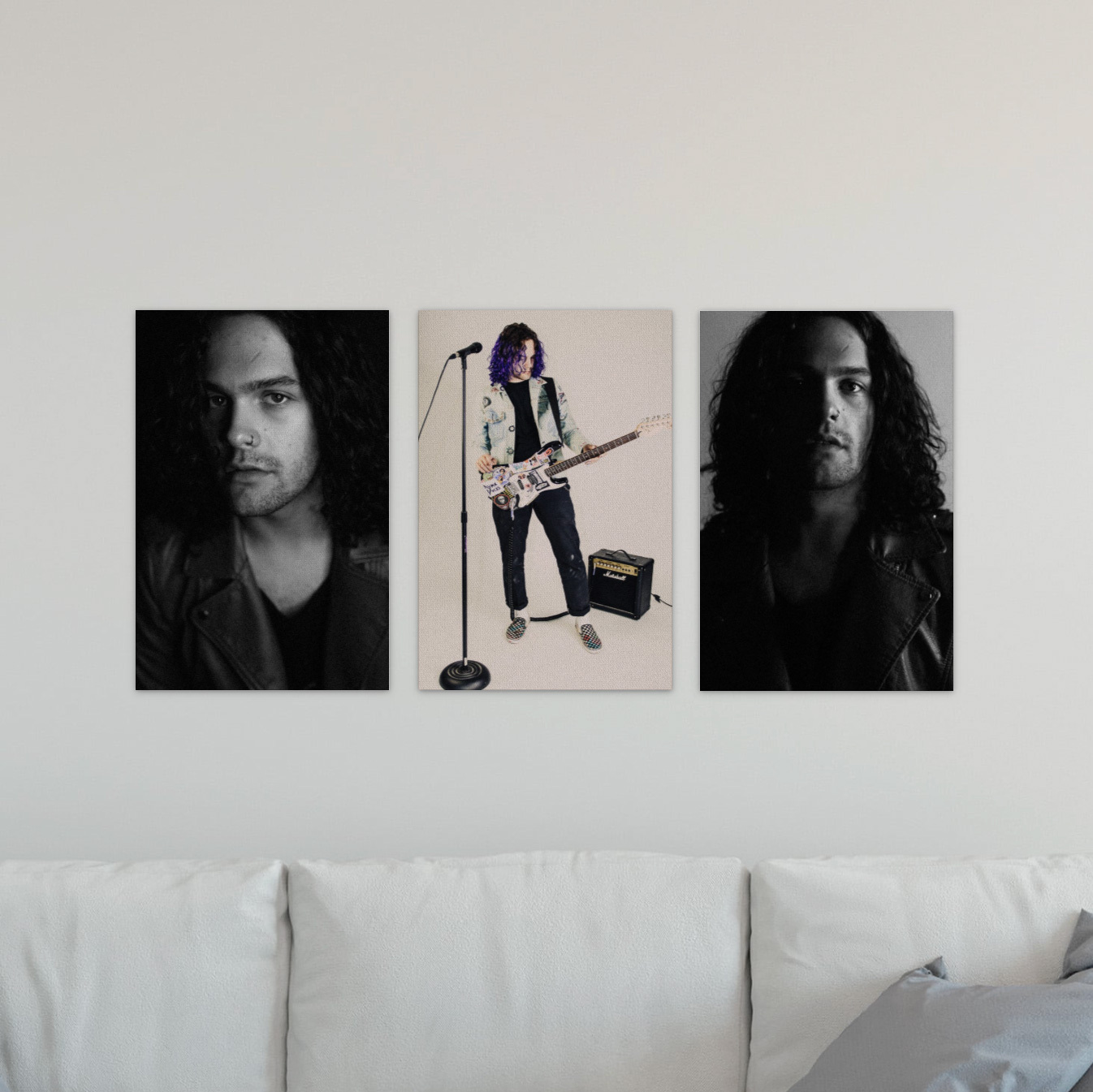 Three Gallery Wraps in a row on a wall above a white couch featuring Senior Graduation portrait imagery of a guitar player, two are black and white. Portraits are inspired by band, musician, and editorial photography styles.