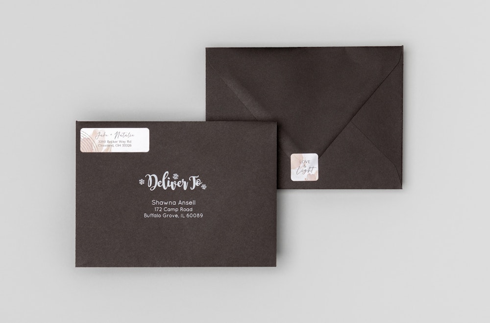 Black premium envelopes with matching address label and seal sticker designs