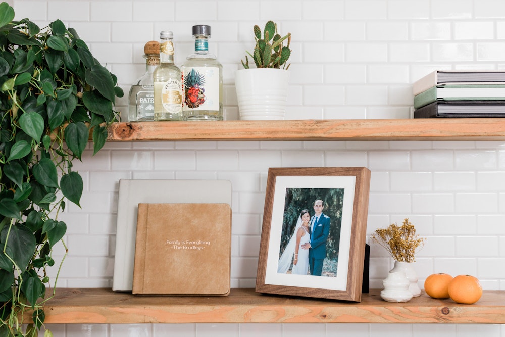 Framed Tabletop Prints and Premium Albums on kitchen shelf