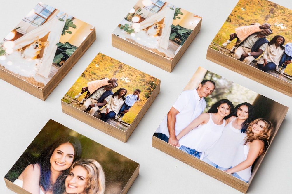 Flatlay of multiple Mini Bamboo Blocks with family and pet portraits