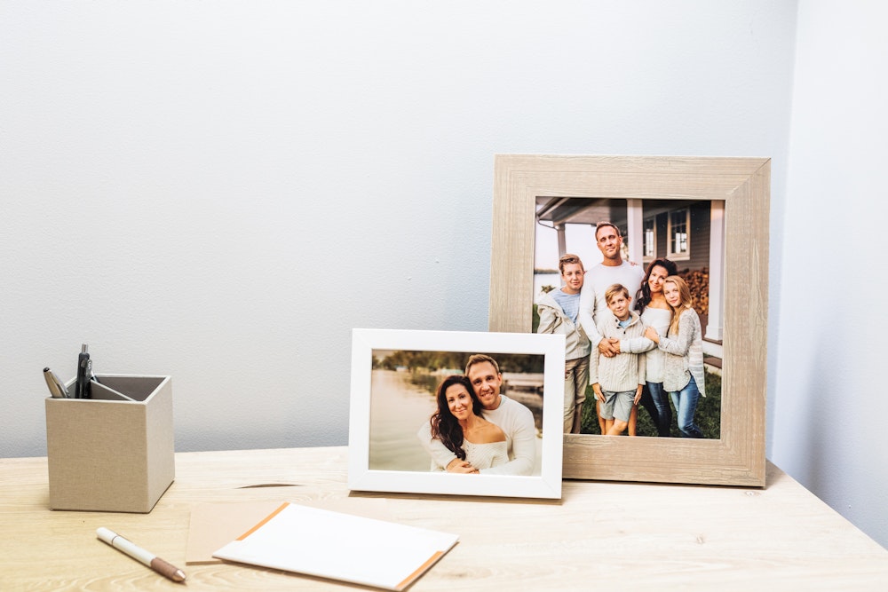 Multiple Framed Tabletop Prints on home office desk